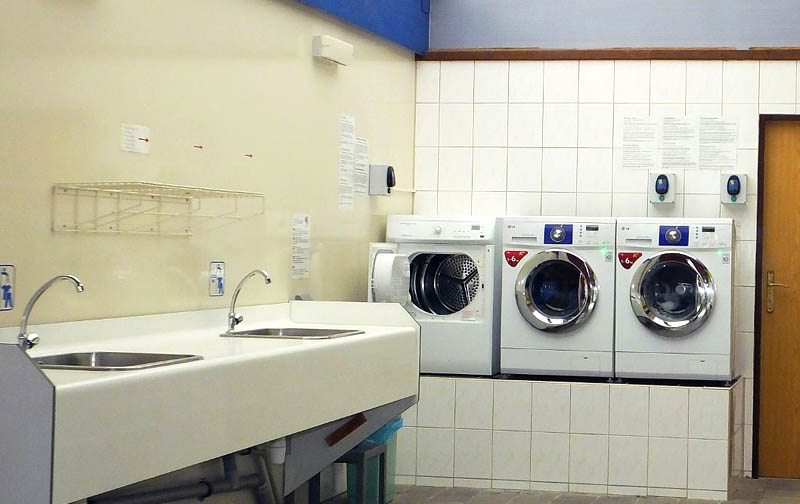 Hand washing of clothes, washing machines and dryers