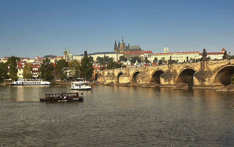 Boats at the Charles Bridge in the Vltava river